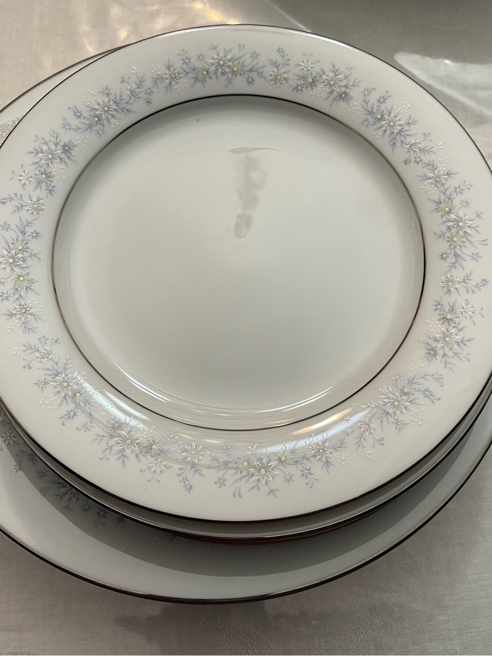 Noritake White Dinner Plate with Pale Blue Floral and Silver Trim